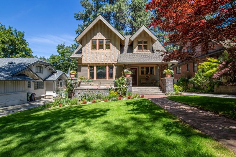 A neatly kept green lawn in front of a home